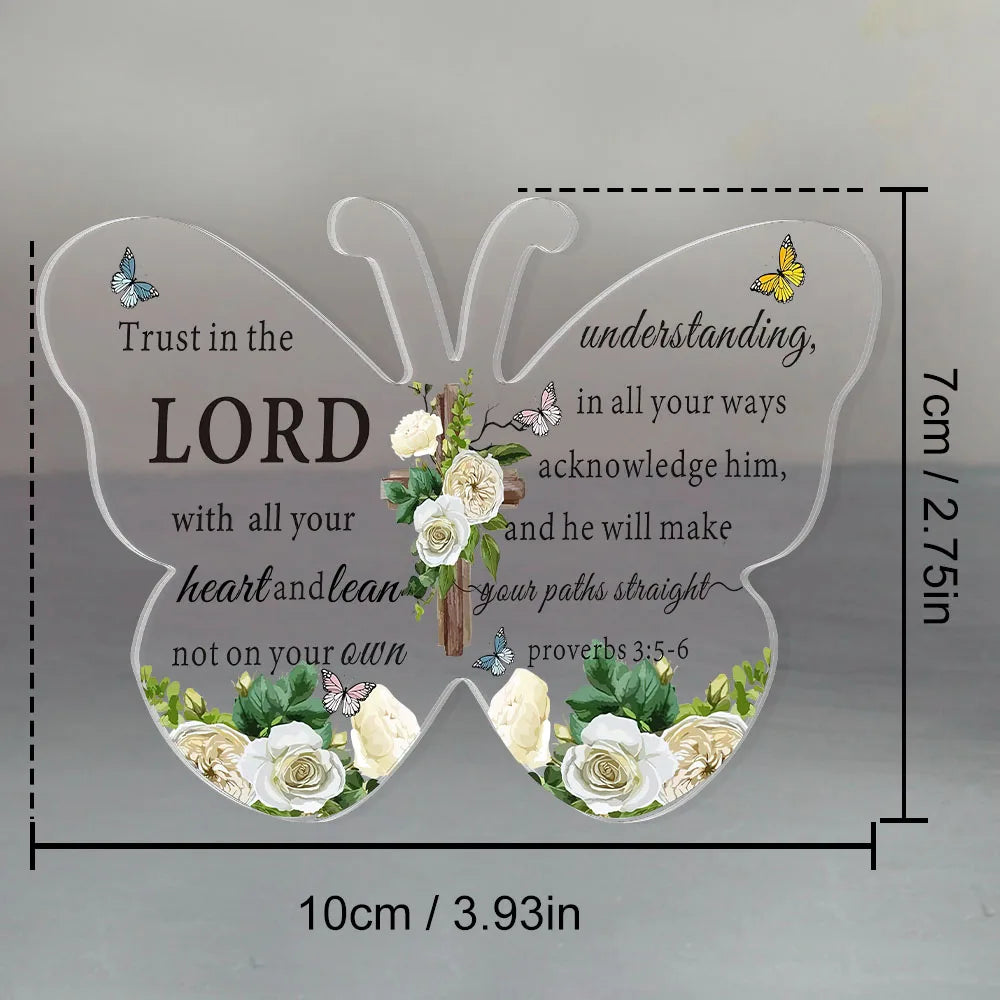 A white acrylic butterfly shaped sign featuring a Bible verse about trusting in the Lord and having understanding.