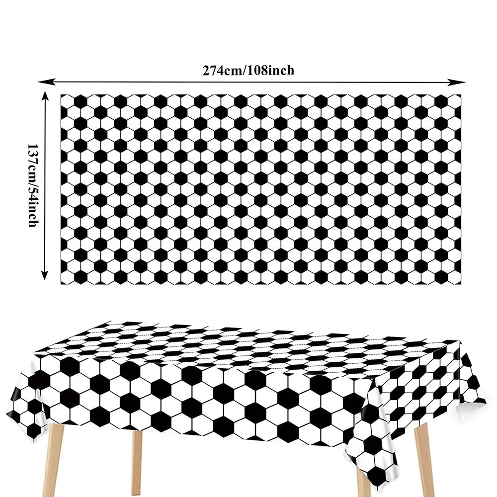 A black and white honeycomb pattern tablecloth displayed on a table.