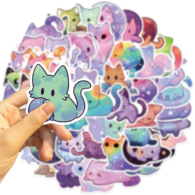 A hand holds a large collection of aesthetic PVC starry sky cat stickers for scrapbooking