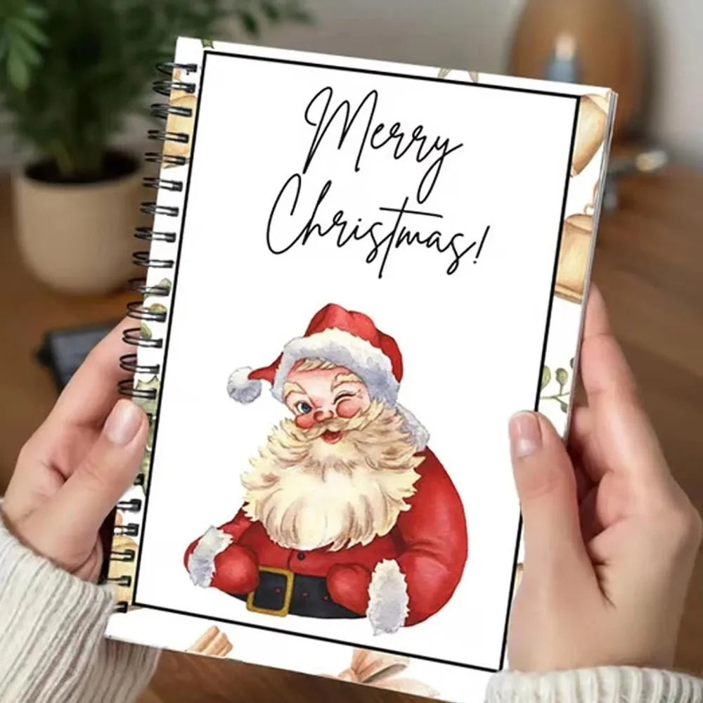 A spiral-bound book with a festive Christmas greeting and an illustration of a bearded man in a Santa hat.