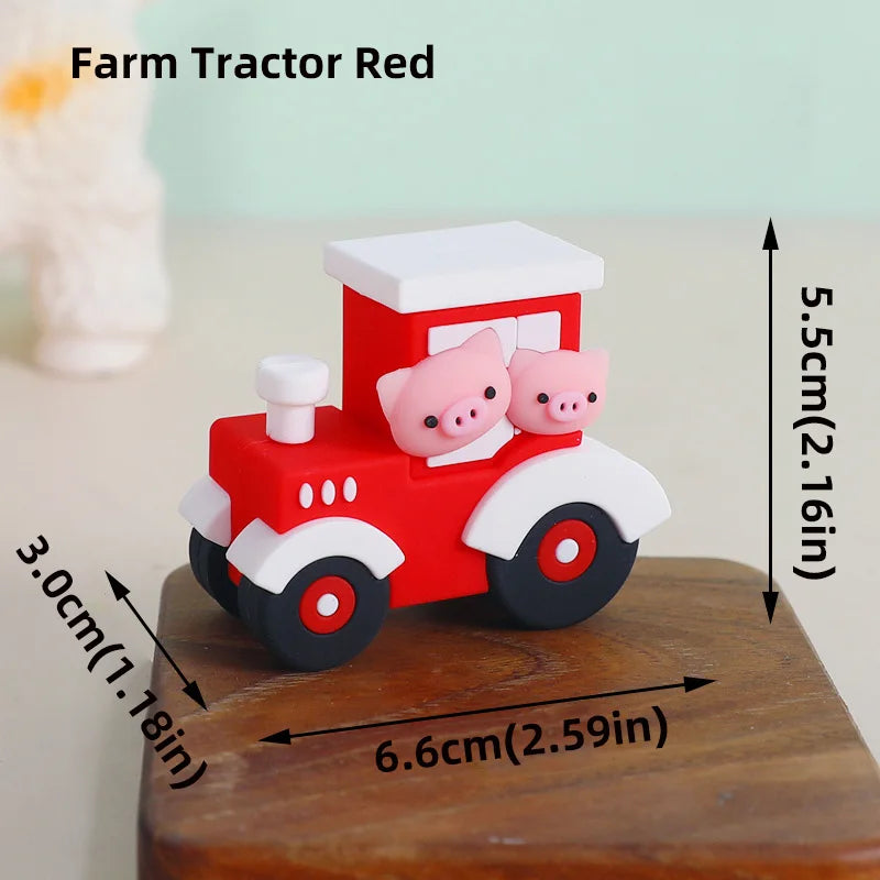 A red farm tractor cake topper featuring pink pig figures on a wooden base.