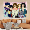A tapestry featuring characters from K-ON! anime series displayed on a wall.