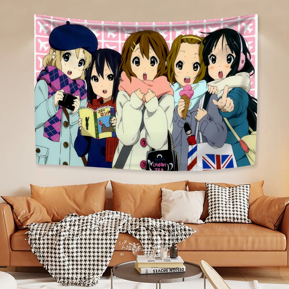 A tapestry featuring characters from K-ON! anime series displayed on a wall.