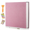 A pink linen scrapbook photo album with a visible page and an orange tool shown next to it.