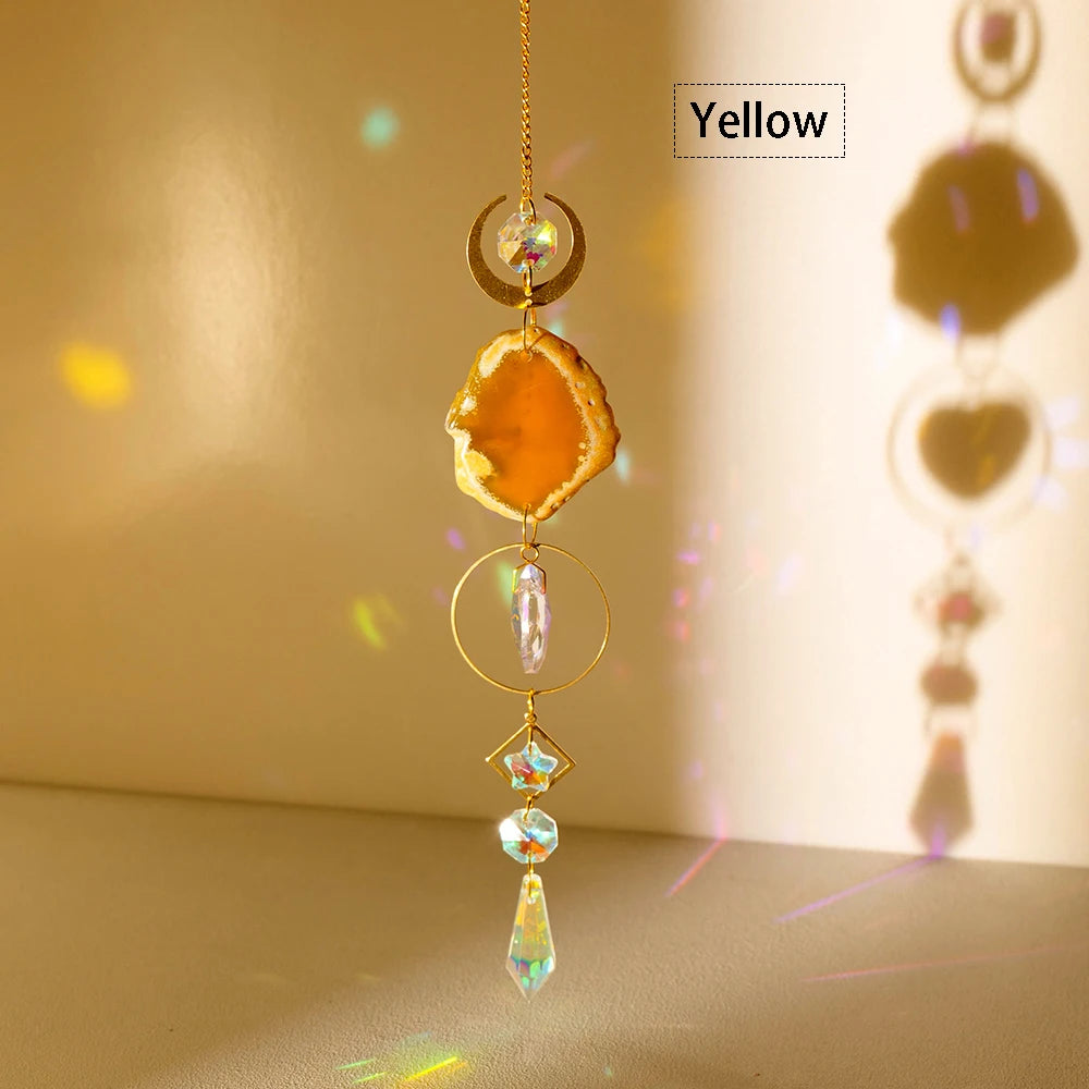 A yellow natural agate sun catcher crystal decor hanging from a gold chain.