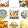 A collection of fridge magnets featuring Scottish Highland cows, an ancient Athens temple, and a cityscape.