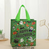 A green non-woven tote bag with Halloween prints and a green handle.