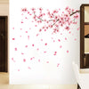 Pink peach blossom branch wall decals featuring delicate pink flowers and petals against a white background