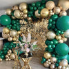 A large balloon arch decorated with jungle green and gold latex balloons for party decor.