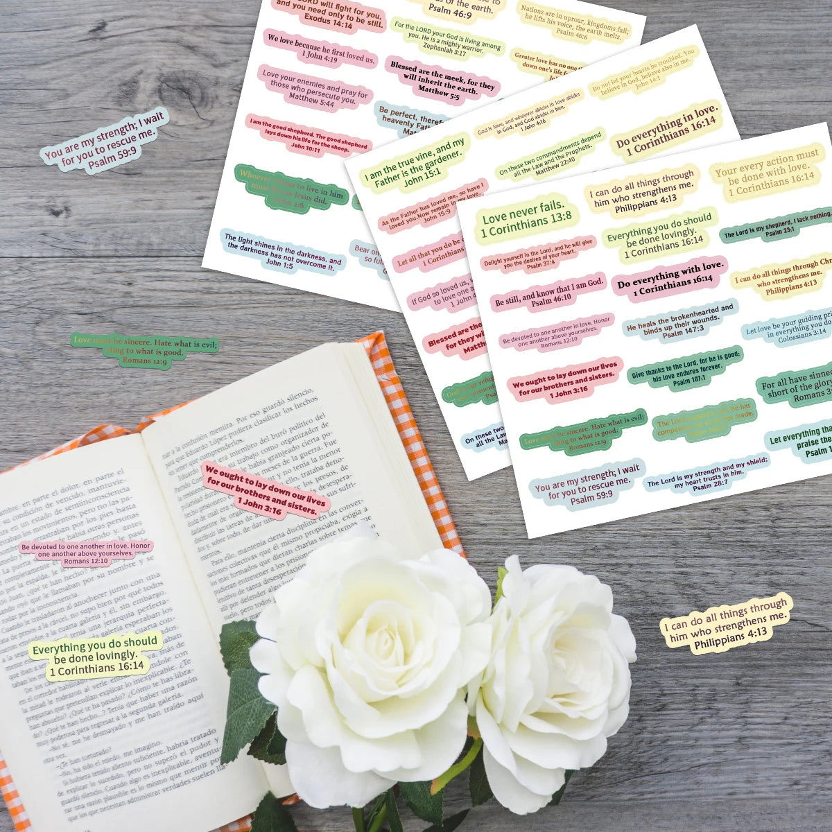 A collection of colorful Bible verse stickers featuring scripture passages on a light gray background.