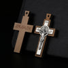 A wooden crucifix pendant with the word JERUSALEM engraved on the cross.