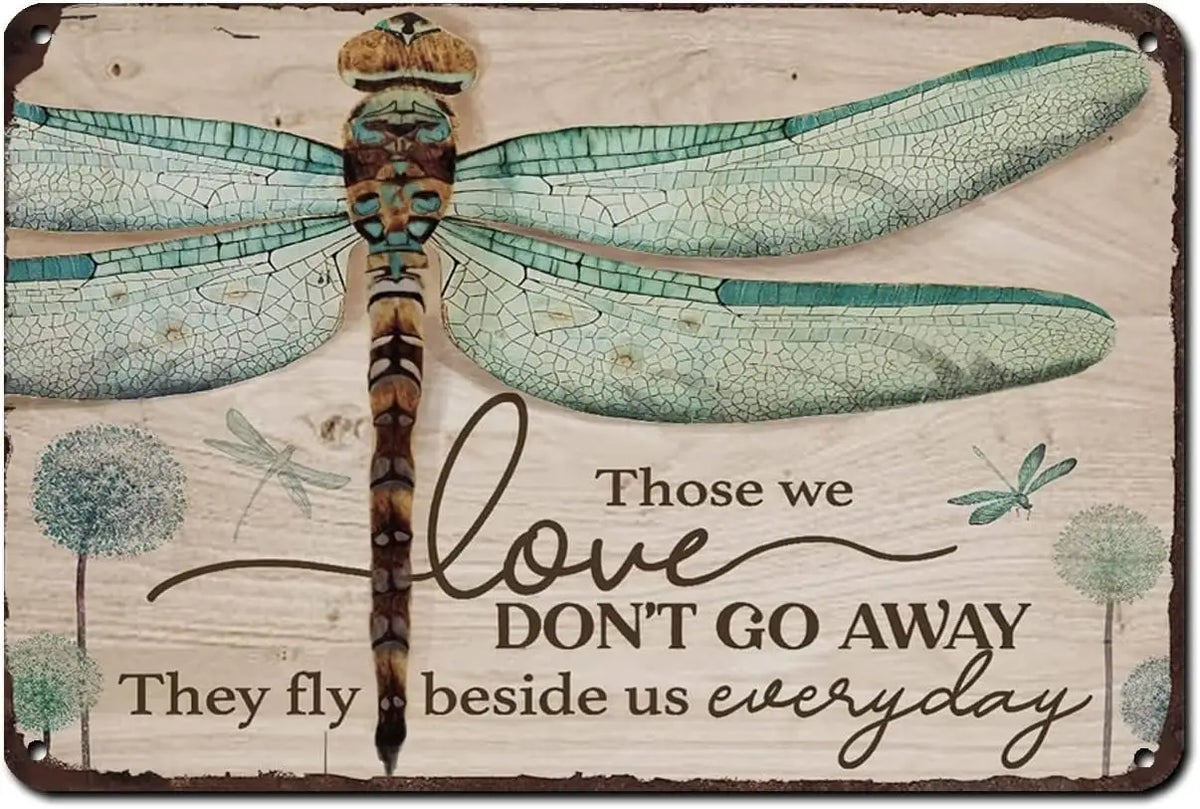 A rustic wooden sign featuring a watercolor illustration of a dragonfly with the text Those we love don't go away they fly be