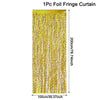 A vertical curtain of gold foil fringe used as a party backdrop