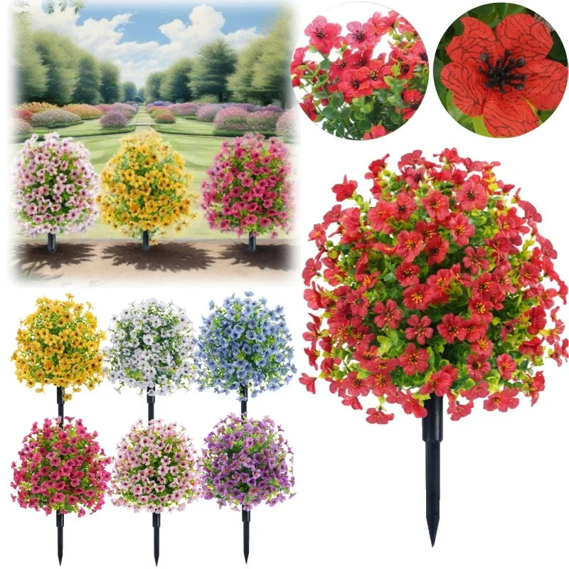 A collection of vibrant artificial flowers in various shades of red, pink, yellow, and purple displayed on stakes.