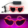 Pink heart-shaped LED wire party glasses with a black light effect