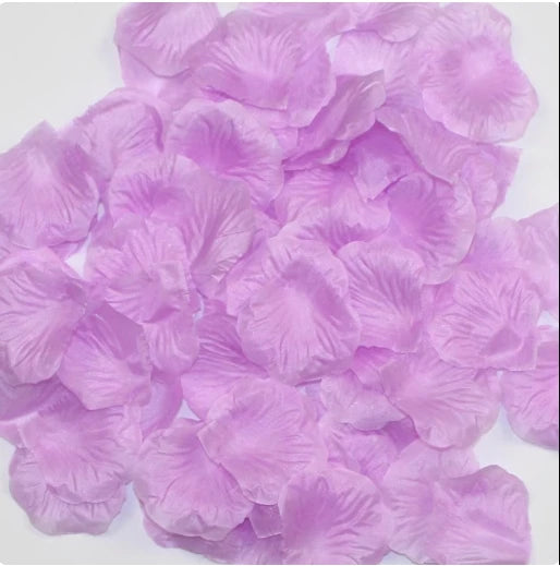 A pile of light purple silk rose petals used for weddings and events.