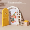 A yellow wooden door with a star design and a white arched doorway featuring a cartoon mouse and a wooden ladder next to a sm