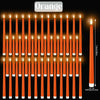 A set of orange flameless LED taper candles standing upright in a row.