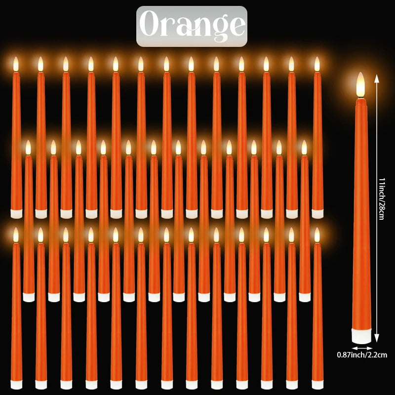 A set of orange flameless LED taper candles standing upright in a row.