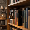A vintage bookshelf lantern lamp illuminates a row of old books on a wooden shelf.