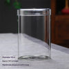 Clear glass cylindrical vase with a lid, approximately 10cm in diameter and 14.5cm high.