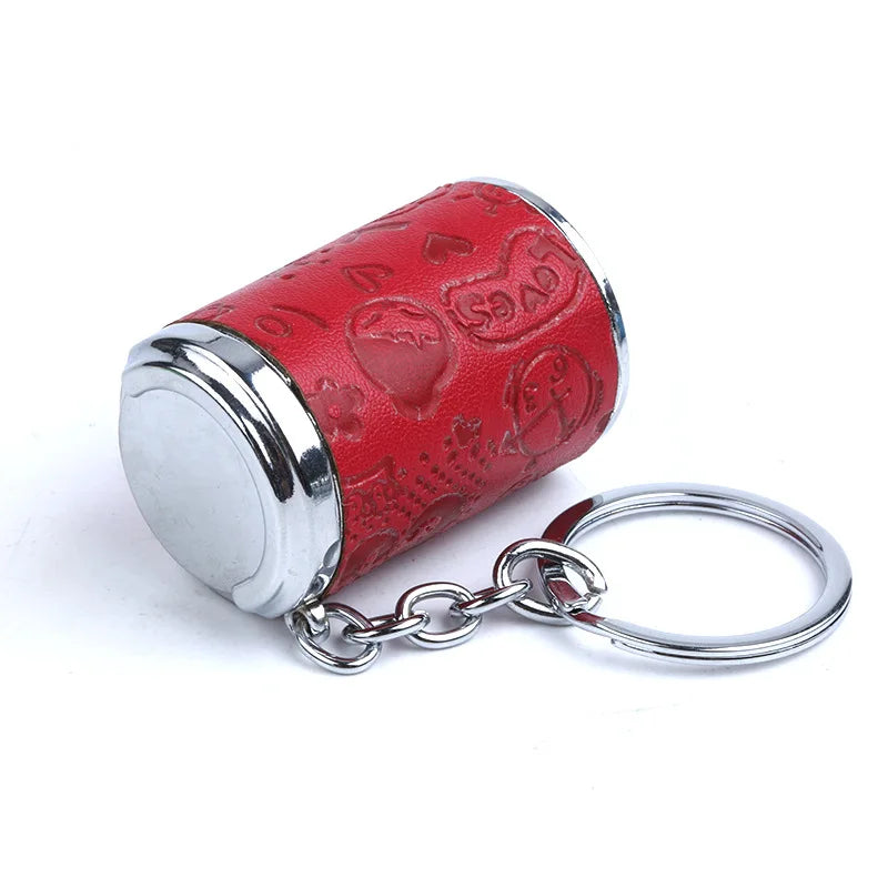 A red textured mini coin holder with a silver rim attached to a metal keychain.
