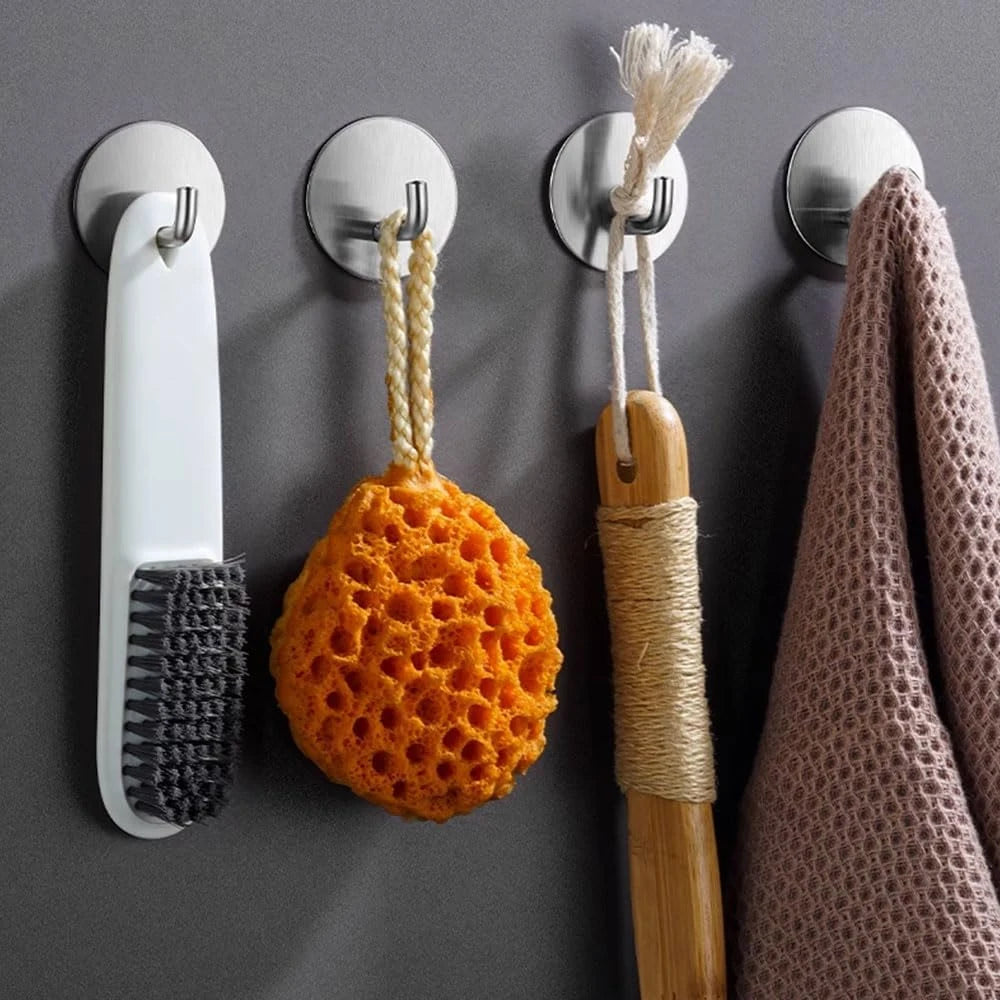 Stainless steel wall hooks with natural fiber cord and orange porous sphere attached