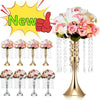 A gold crystal flower centerpiece stand with cascading crystals and pink and white roses.