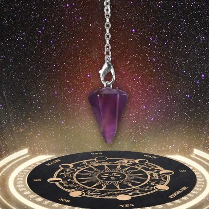 A purple gemstone pendant hangs from a silver chain above a divination board with zodiac symbols.