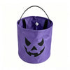 Purple fabric trick-or-treat bag with a black carved pumpkin face design
