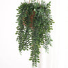 Artificial ivy vine with green leaves hanging from a natural brown pot for home decoration