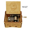 A wooden music box featuring a character design and a metal mechanism, labeled 18-SJ7.