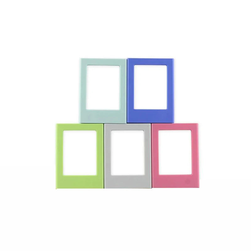 A set of four magnetic mini photo frames in pastel colors: mint green, light blue, purple, and pink.