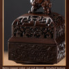 A dark copper incense burner featuring intricate cut-out design and detailed texture engraving.