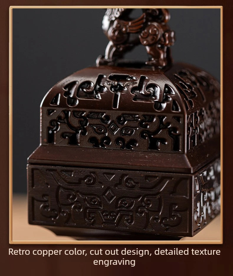 A dark copper incense burner featuring intricate cut-out design and detailed texture engraving.