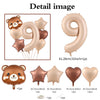 A set of foil balloons featuring a bear design and the number nine in caramel color.