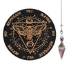 A black wooden pendulum board featuring a geometric design and text like YES, MAYBE, NO, REPHRASE, and a rose quartz crystal 