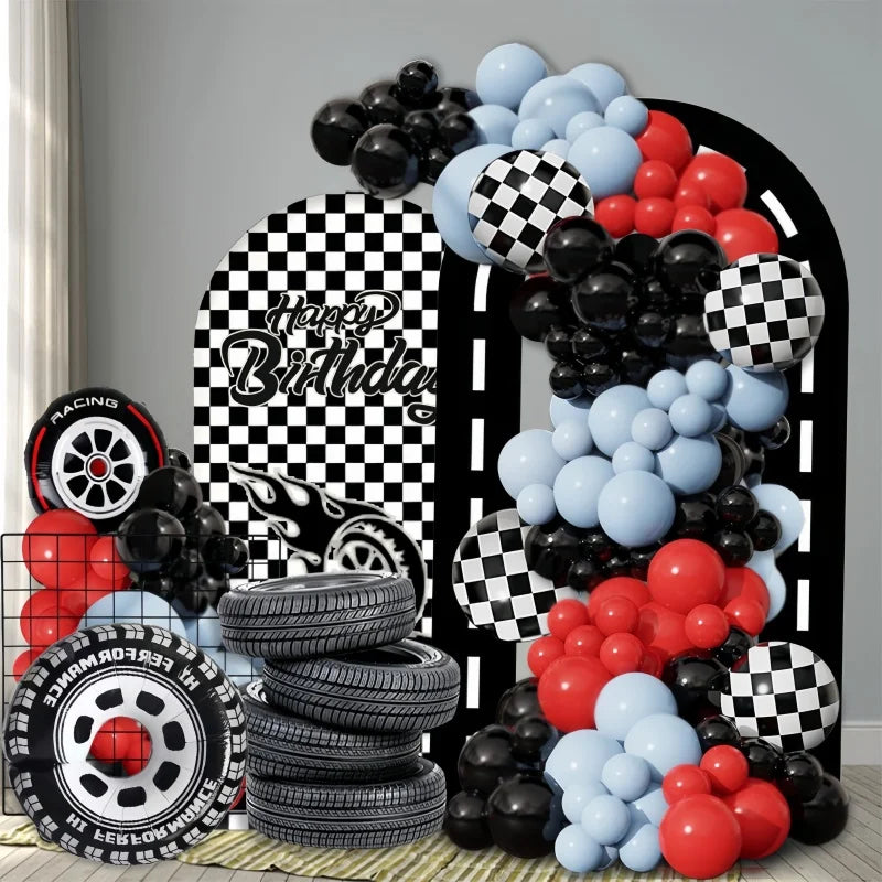 A balloon arch set featuring black, red, and blue balloons in a checkered pattern.