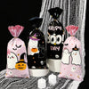 Three Halloween candy treat bags featuring a little boo design in pink and black packaging