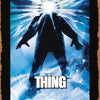 A vintage metal tin sign featuring a poster of the movie The Thing with John Carpenter's title.