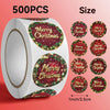A roll of 500 festive Christmas wreath stickers in red and green designs for gift wrapping and card decoration.