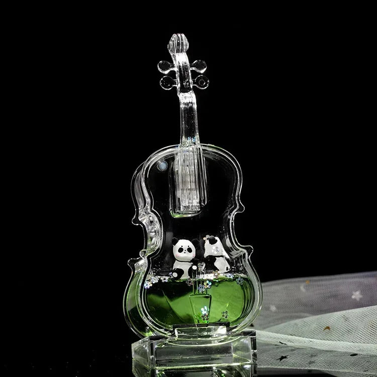 A clear glass hourglass filled with green liquid and featuring two small panda figurines.