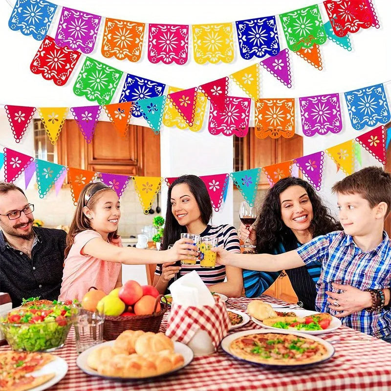 Colorful papel picado banners strung across a festive setting for celebrations