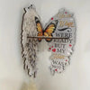 A decorative wall shelf featuring angel wings shaped like butterflies and text that reads Your Wings Were Ready But My Heart 