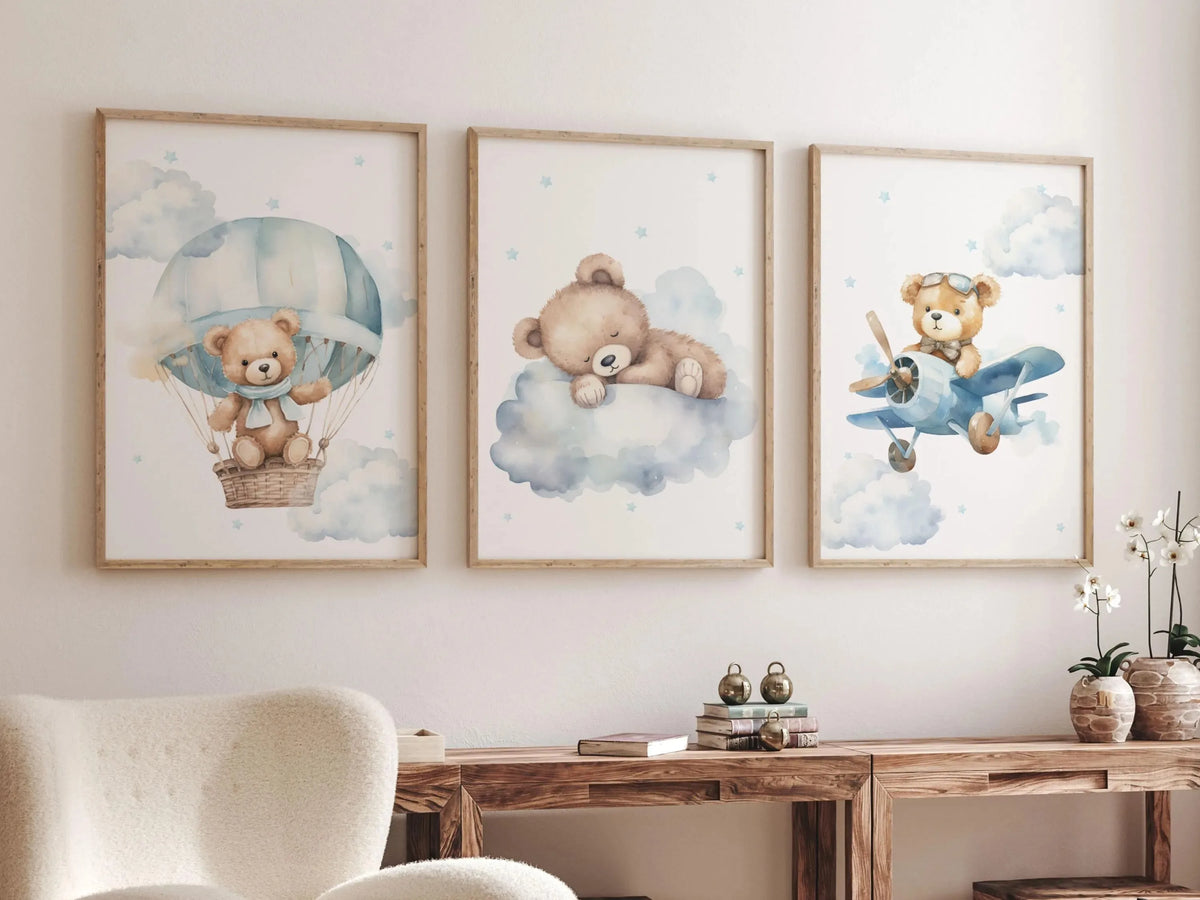 A set of three watercolor canvas prints featuring teddy bears in hot air balloons against a soft blue sky and clouds.