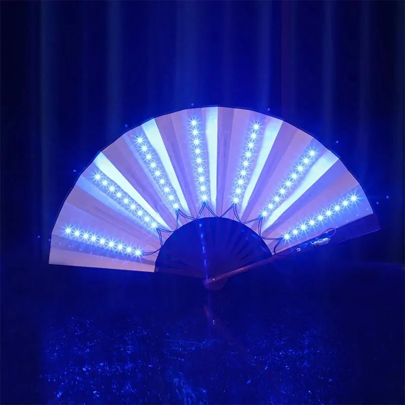 An illuminated folding hand fan with LED lights opening to reveal bright white light rays against a dark blue background.