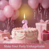 A pink birthday cake with a pink flower topper and candles on a table surrounded by pink balloons and gifts.