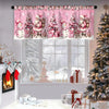 Pink festive Christmas valence curtains hanging in a window with a decorated Christmas tree and gifts