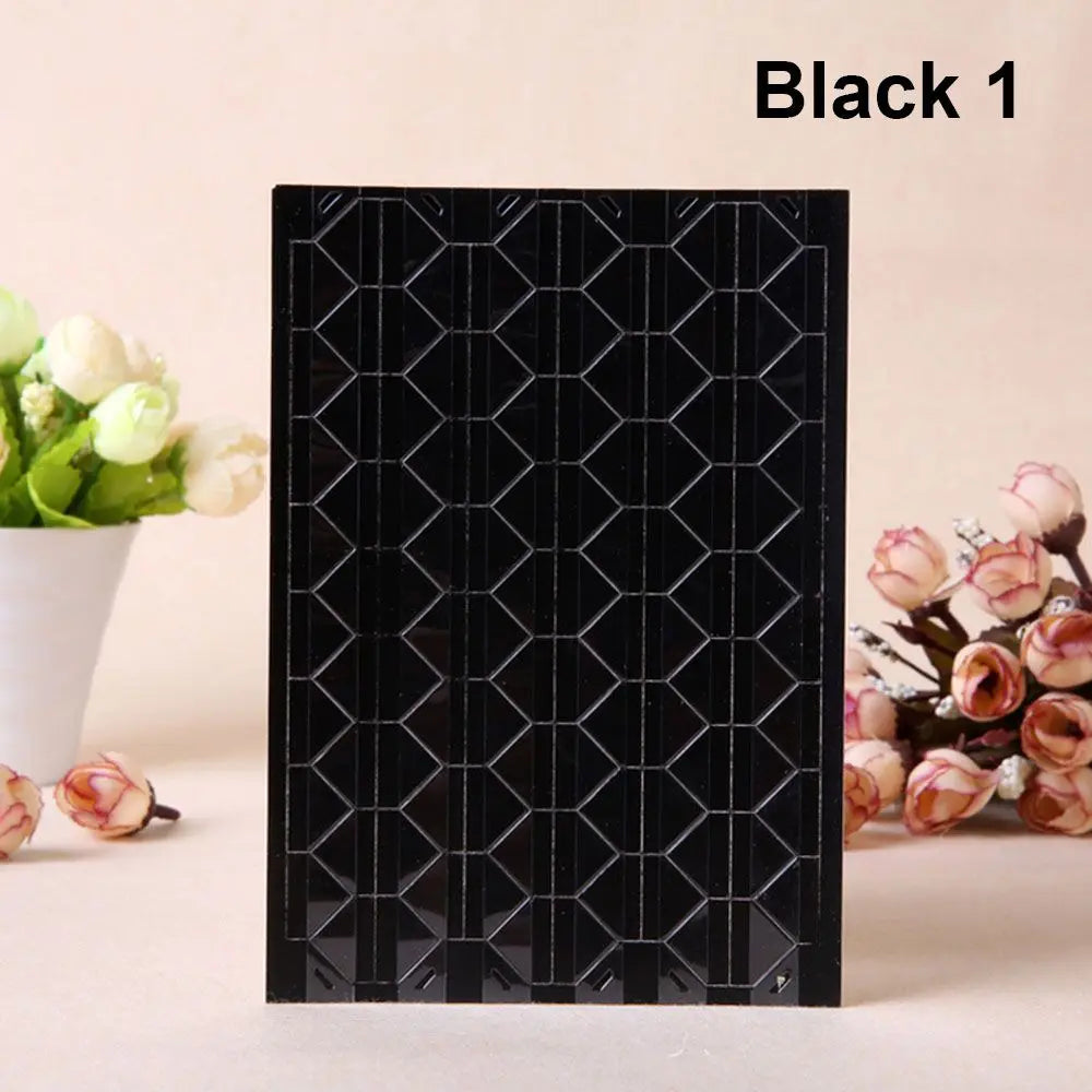 Black photo corner protectors with a hexagonal grid pattern for scrapbooking and albums