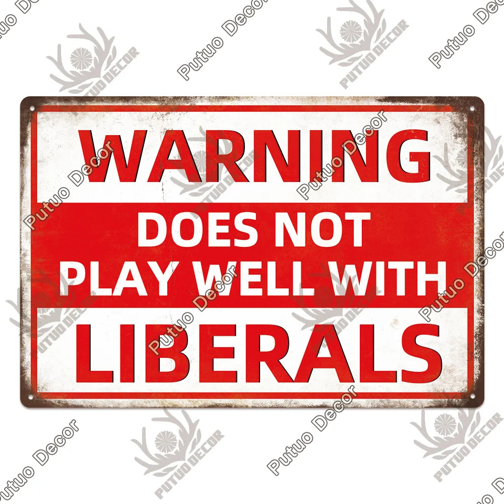 A vintage metal warning sign with red text that reads WARNING DOES NOT PLAY WELL WITH LIBERALS.
